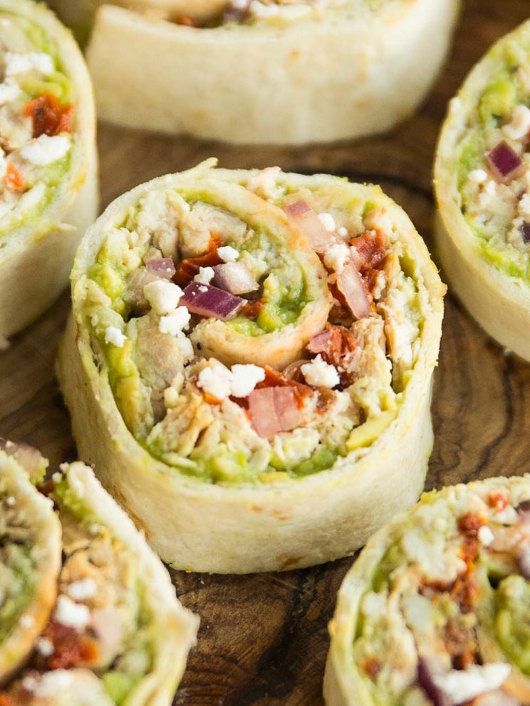 tortilla roll up close up shot of tortilla roll up on wooden chopping board
